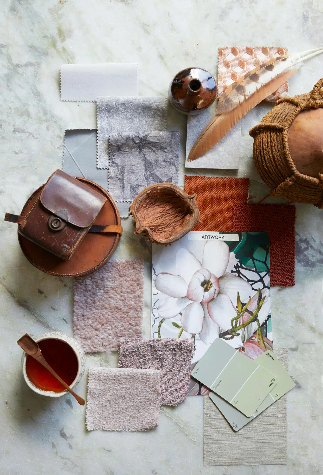 A variety of fabric samples alongside colour swatches and decorative accents curated to showcase a variety of textures.